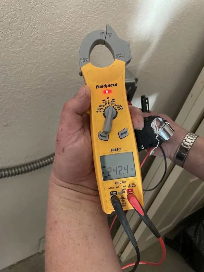 Voltage testing with clamp meter during Circuit Breaker Repair in Zebulon